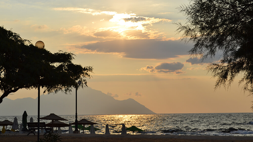 beach in the golden hour, Athos mountain 