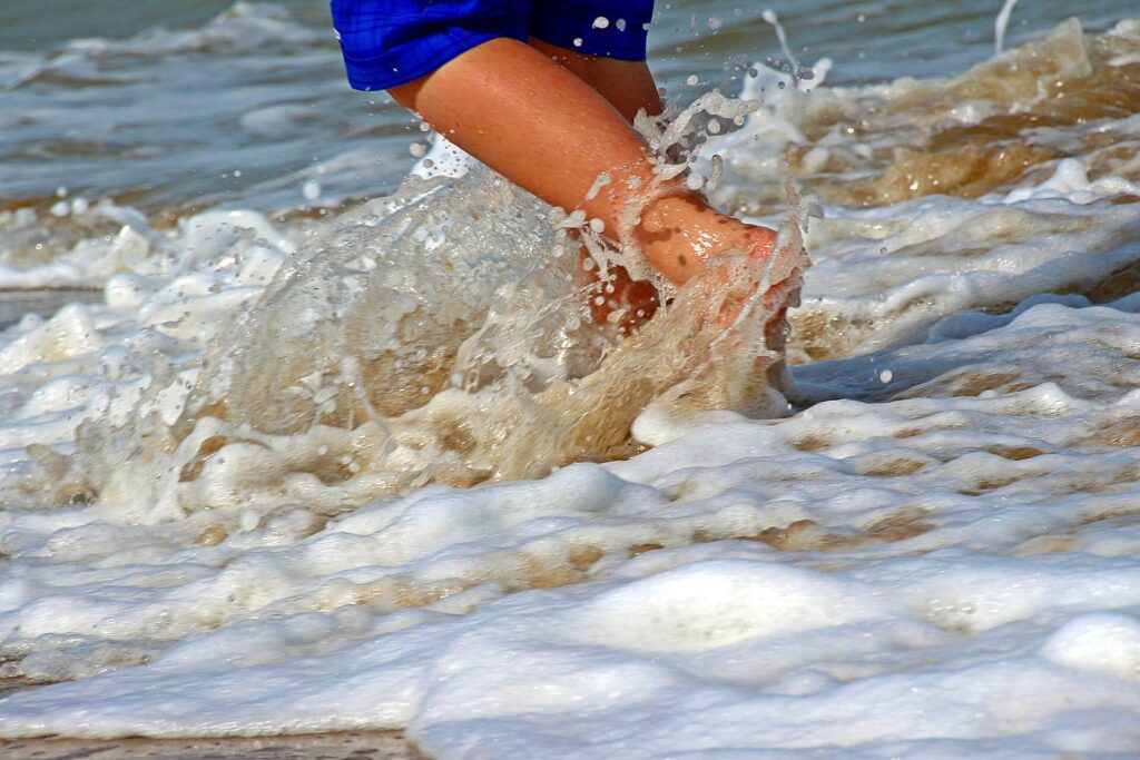 walking barefoot on beach Sithonia Greece